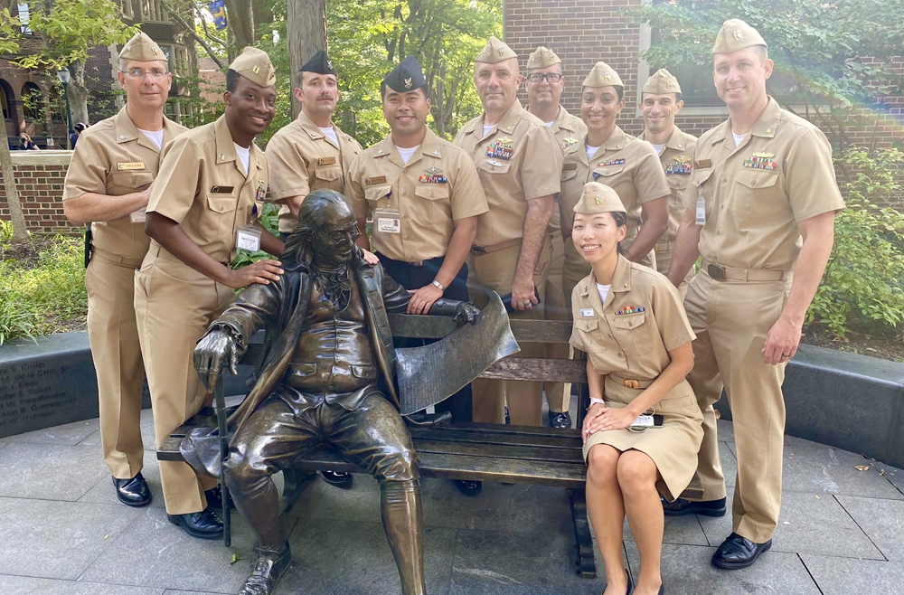 The first Navy team with the Ben Franklin statue on campus in 2021.